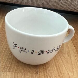 FRIENDS tv show mug with a white exterior and lettering on outside.
